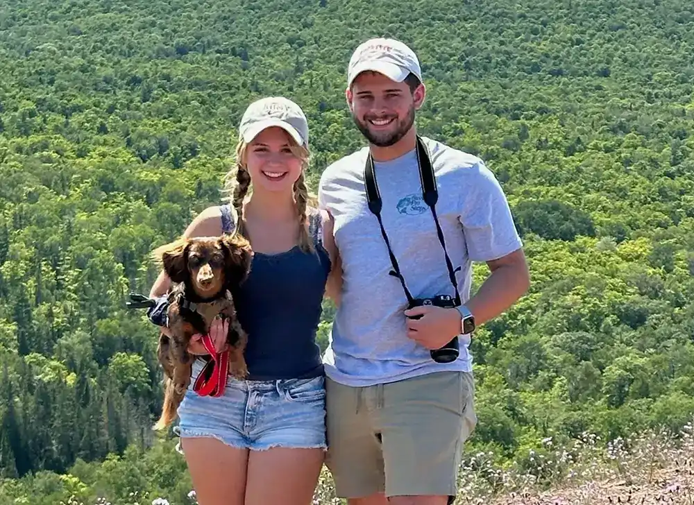 MozzieMakes founders holding their custom fidget sliders
